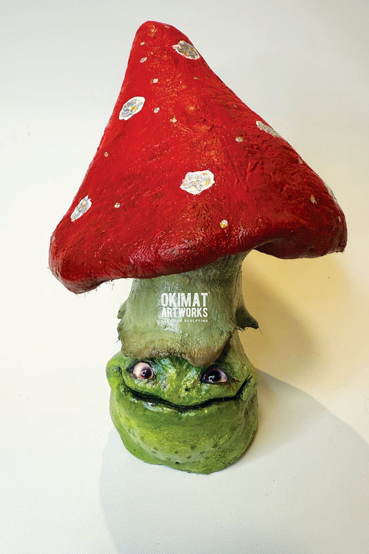 Small toadstool frog sculpture made with Pal Tiya Premium cement sculpting clay — a perfect beginner project using aluminum foil as an armature